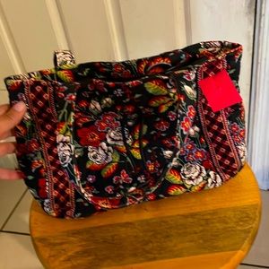 Floral Vera Bradley purse with customized “M” stitched on front of bag.